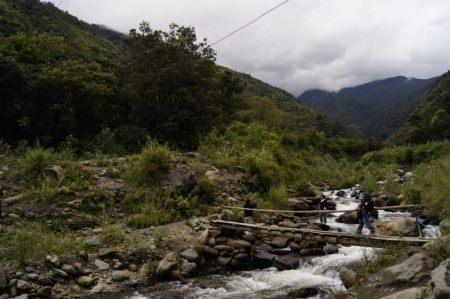 Me crossing the Amazon river in Baños, Ecuador